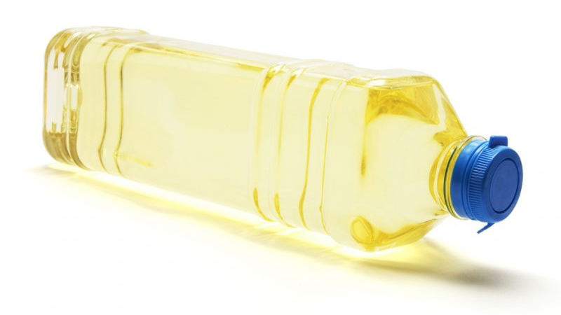 plastic bottle cooking oil on its side