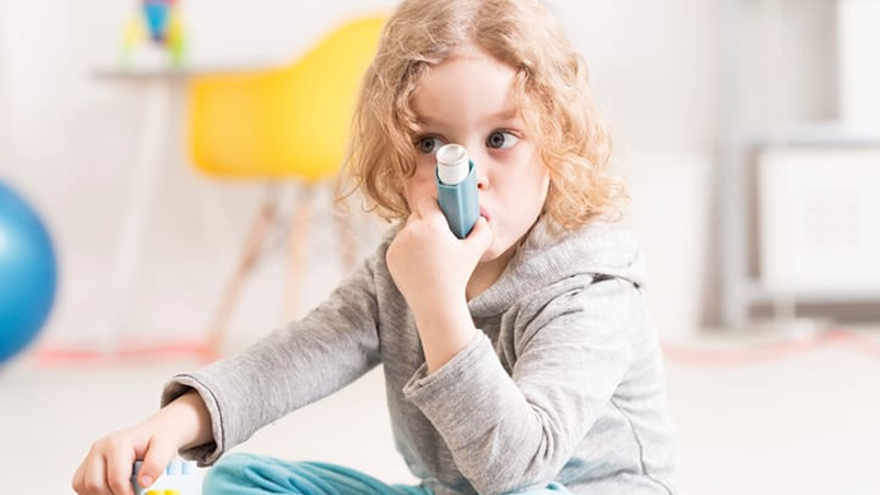 young person using inhaler