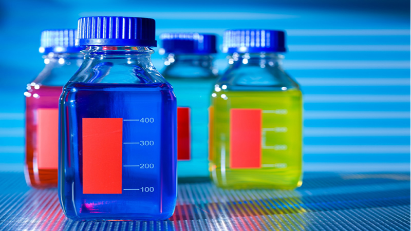 assorted colored lab bottles