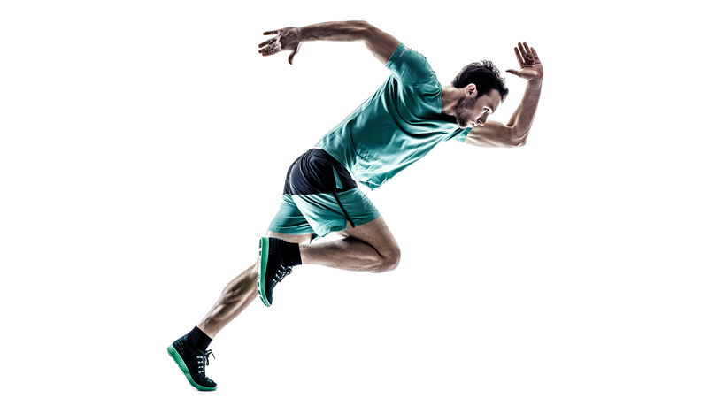 athletic man leaning forward in running stance