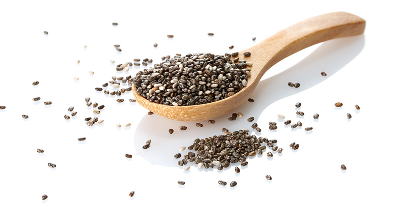 Chia Seeds in and around wooden spoon