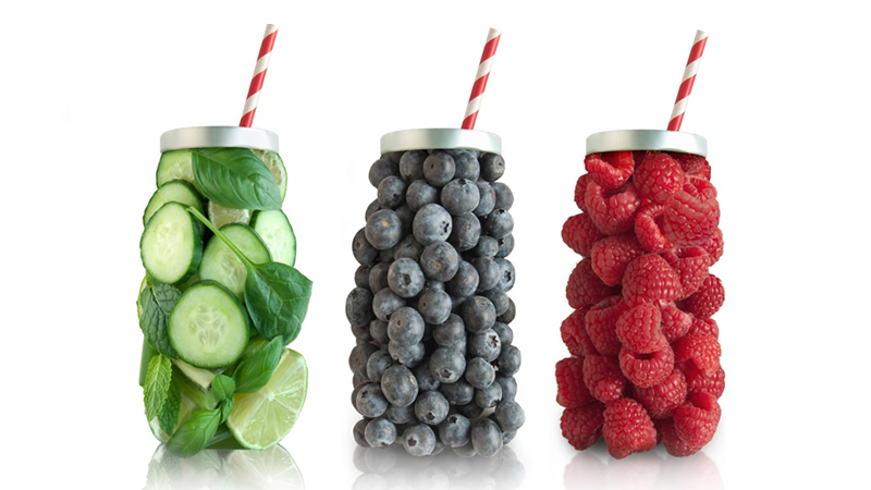 cucumber, blueberries and raspberries in shape of jars with straws