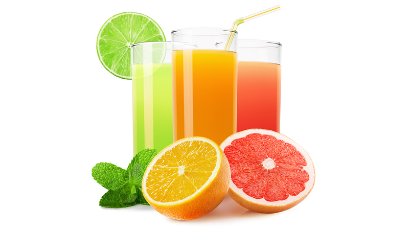 3 glasses of citrus fruit juices and slices