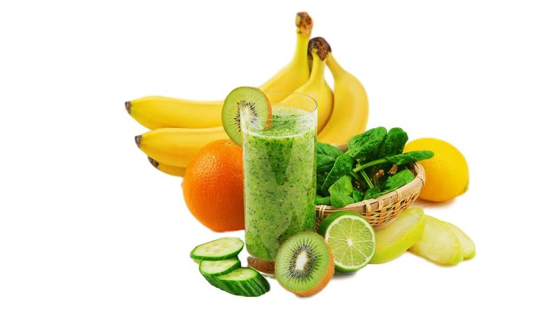 green smoothie in middle of fruit pile