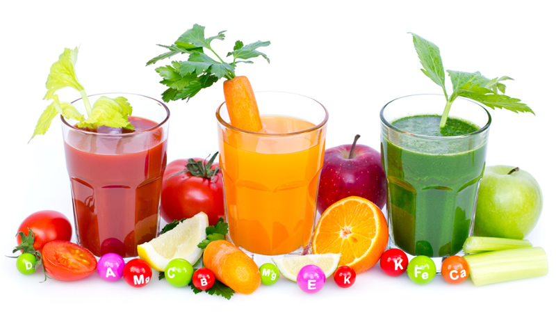 3 colorful smoothies with fruit, vegetables and supplement tablets