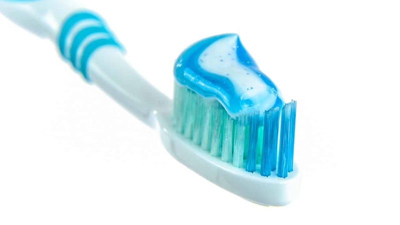 close up of toothpaste on toothbrush