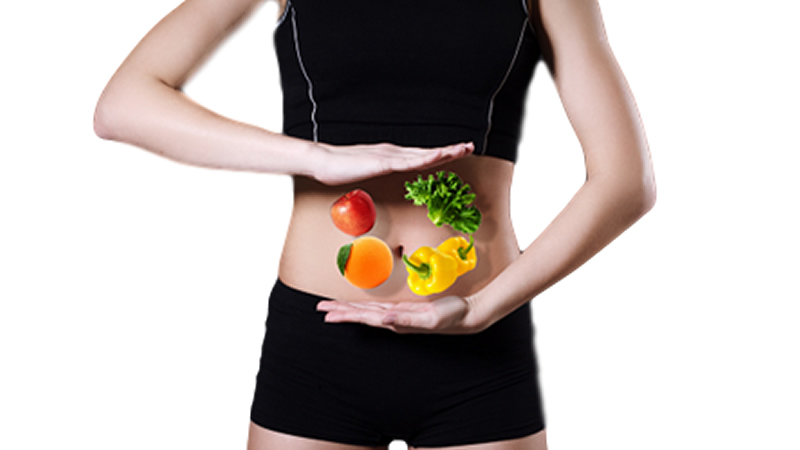 woman holding her hands in front of her belly as if balancing floating vegetables and fruit