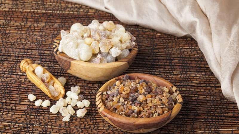 Frankincense and Myrrh in wooden bowls and scoop