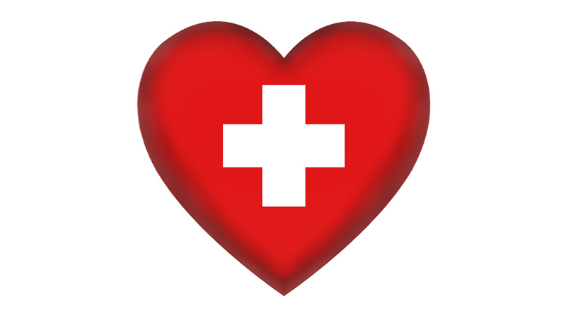 first aid symbol red heart with white cross inside