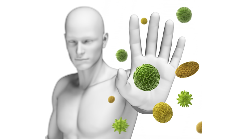 man with hand out as if to stop green germs