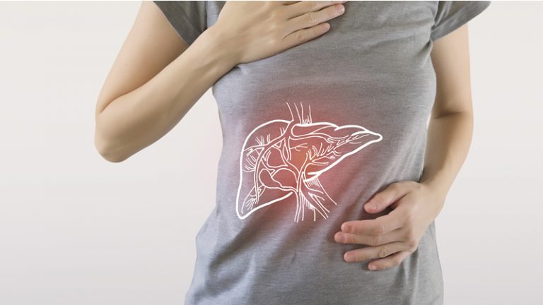 woman holding abdomen as if in pain with liver drawn on Tshirt