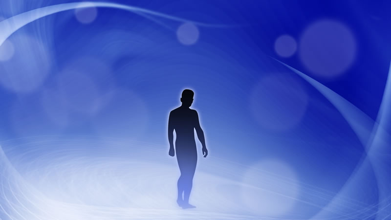 silhouette of man against blue and white background