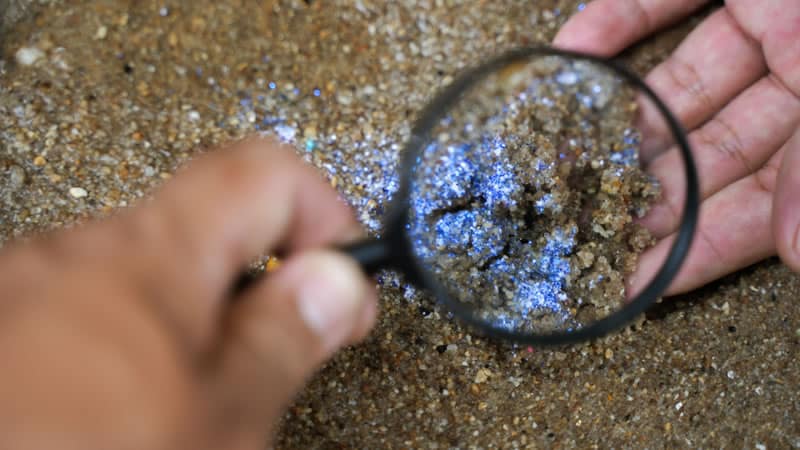 Looking at sand through a magnifying lens