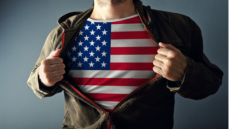 man pulling his jacket open to expose USA flag Tshirt