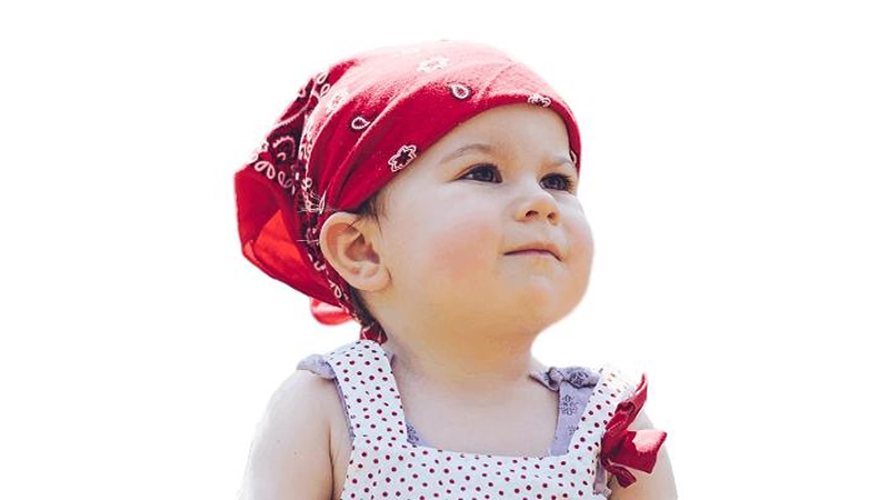very young girl with scarf on head
