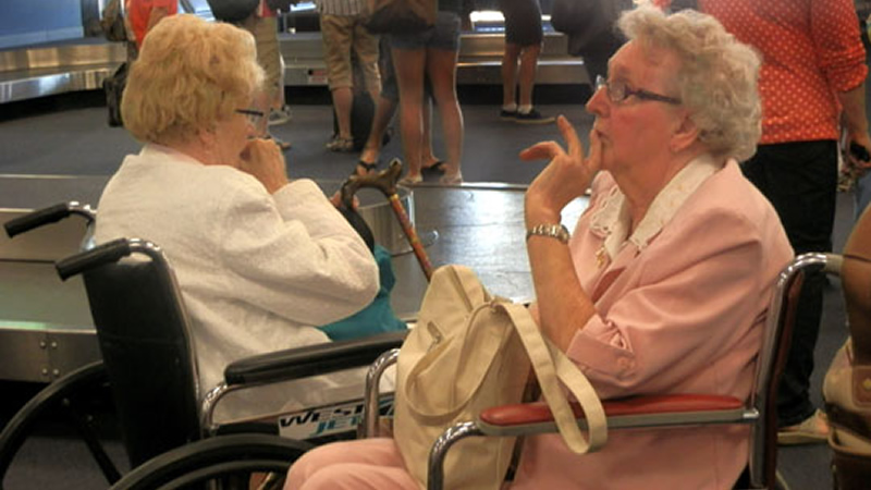 two elderly women in wheelchairs
