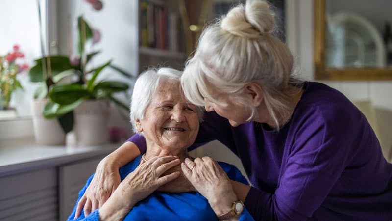 Older Woman Comforted by Younger