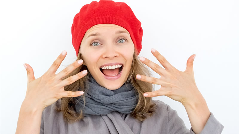 smiling woman showing all ten fingers