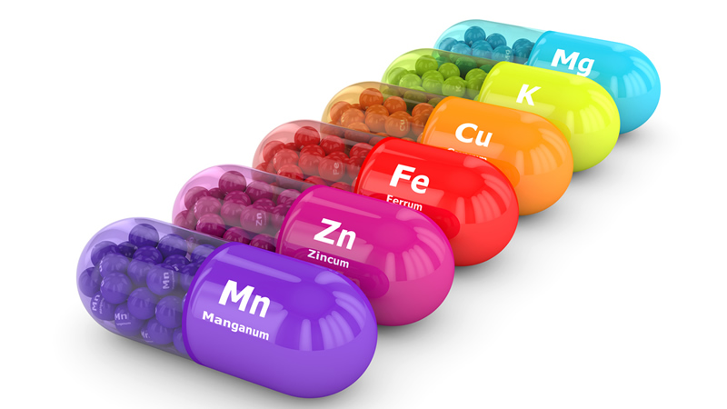 assorted colorful mineral capsules on white