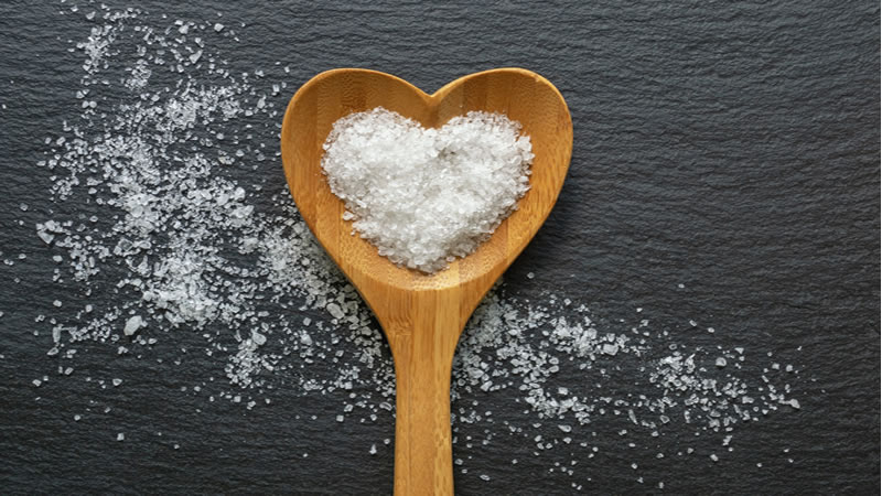 crystal salt on heart shaped wooden spoon