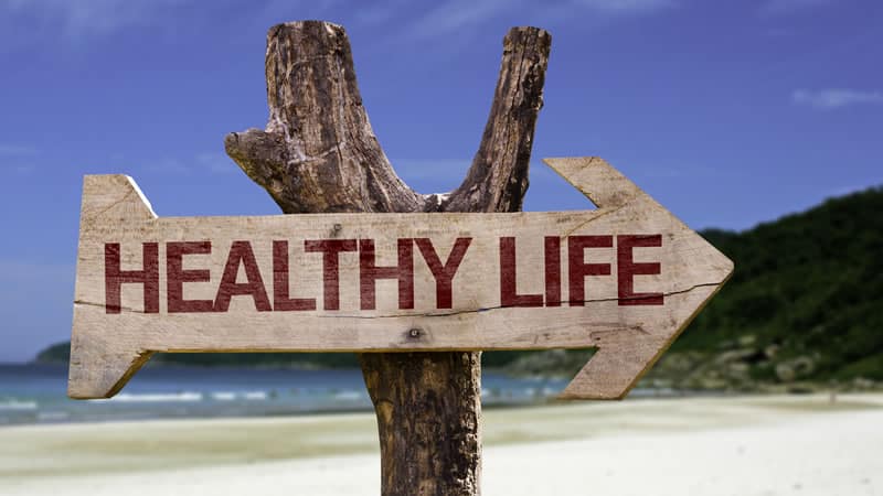 sign pointing to Healthy Life