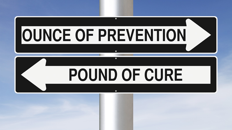 road sign with arrows indicating Ounce of Prevention or Pound of Cure
