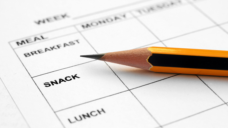 weekly meal schedule for breakfast, snack, lunch with pencil on top